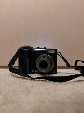 Olympus SP-350 Compact Digital Camera in Black and Silver